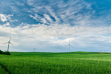 Wind turbine in the field. Wind power energy concept. Renewable energy for climate protection