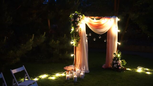 arch for a wedding ceremony at night