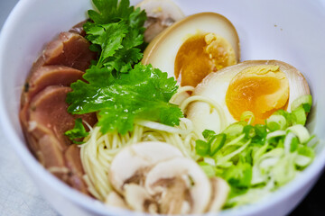 Japanese ramen soup with veal, egg, chives  - traditional Asian dish