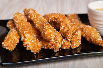 chicken fingers and mustard sauce.