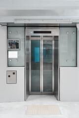 Modern Elevator and Interior Decoration of Lobby Entrance Flooring, Steel Door Accessibility Gate Elevator of Office Building. Lift Access Doorway in Lobby Hall Room, Hallway Decor Design of Hotel