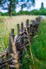 Old wooden fence in Ukrainian village, rural scenery