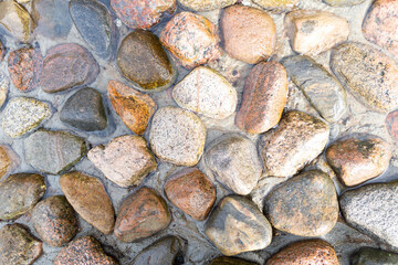 Mountain stream with stones. Flowing river with. Spring running water over stone background