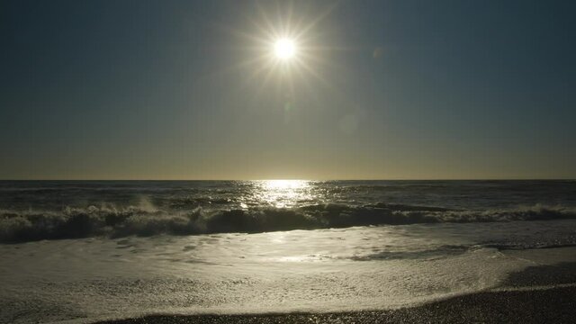 Beautiful View the Tasman Sea from a shore in New Zealand - Sunset - Clear Sky