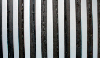Fototapeta premium Background from brown and white boards. Background from brown-white stripes.