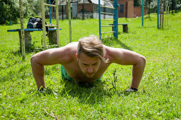 young man doing push ups