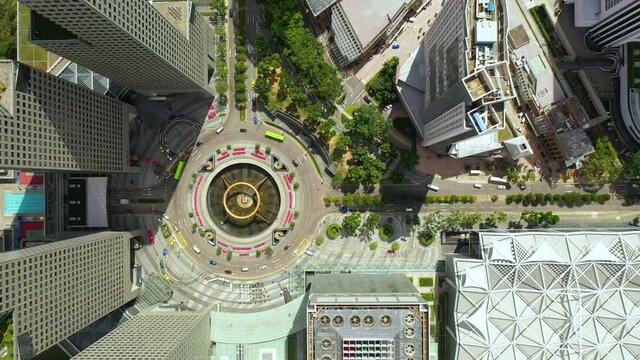 Drone Aerial view 4k Footage of Singapore landmark financial business district with skyscraper. Fountain of Wealth at Suntec city in Singapore. Motion circle of traffic in center