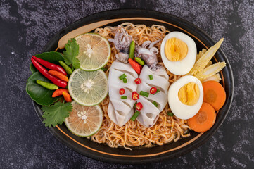 Tom Yum Mama with Squid and Boiled Egg.