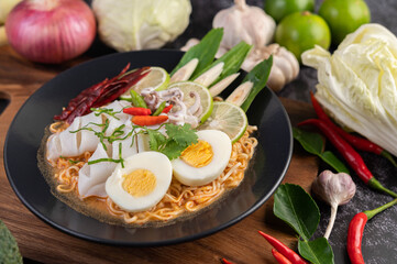 Tom Yum Mama with Squid and Boiled Egg.