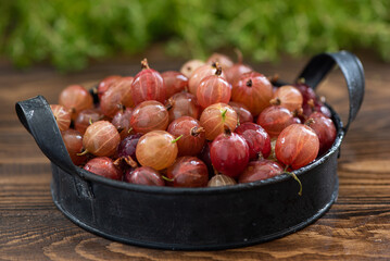 fresh large berries of red gooseberry on a plate