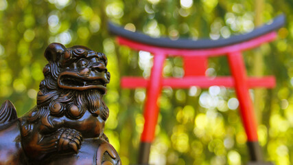 Torii Gate and Okinawan Statue
