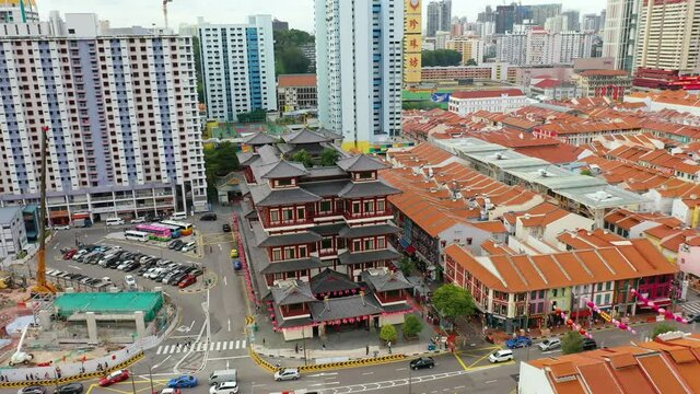 Drone Aerial view 4k Footage Of Chinatown Skyline in the Morning Showing a Mix of Traditional Shophouses and Modern Buildings. Buddha Tooth Relic Temple in Singapore.