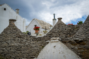 Fototapeta na wymiar La ville d'Alberobello en Italie et ses Trullos fabriqués en pierre