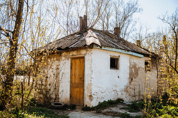 Fototapeta na wymiar An old run down, weather beaten house that is in need of repair, housing problems.