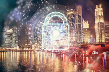 Lock icon hologram on city view with skyscrapers background multi exposure. Data security concept.