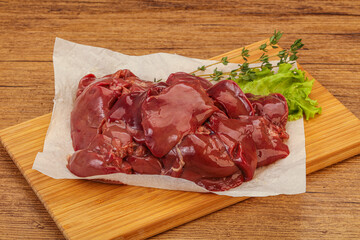 Raw chicken liver over board