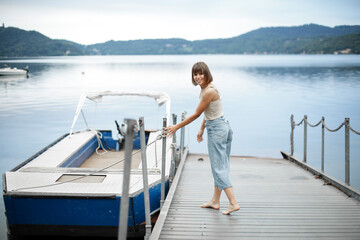 Fototapeta na wymiar Youn woman with her boat