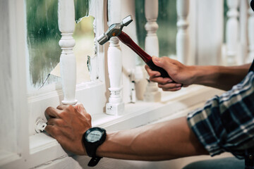 Fototapeta premium The carpenter holds the hammer and nails.
