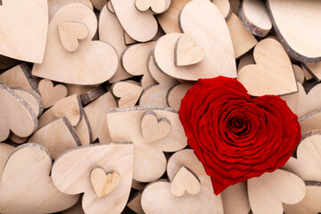 Red heart rose, valentine day greeting card. Wooden hearts background.
