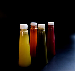 Fruit juice in a bottle on a Black background