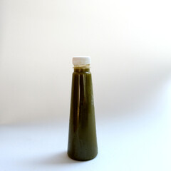 Fruit juice in a bottle on a white background