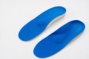 Orthopedic medical insoles isolated on a white background.