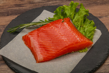 Salmon piece steak served rosemary