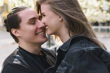 Fototapeta premium Young cheerful couple during a date outdoors