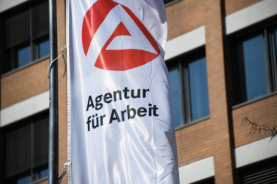 Hanover, Lower Saxony / Germany - April 12, 2020: Flag with the Logo of a Job Center - Agentur f&uuml;r Arbeit, the state owned employment agency in Hanover, Germany