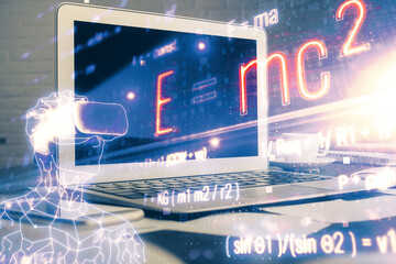 Desktop computer background and formula hologram writing. Double exposure. Education concept.