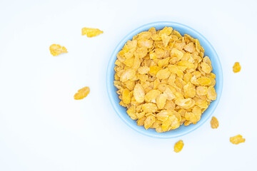 Top view of cereal Grains in yellow cereal in a blue plate