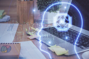 Double exposure of table with computer and brain hologram. Data innovation concept.