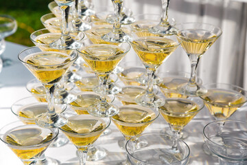 Photo of the champagne pyramid on wedding banquet