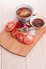 Cooking ingredient,on a chop board,isolated over wooden background
