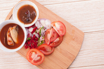 Cooking ingredient,on a chop board,isolated over wooden background