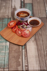 Cooking ingredient,on a chop board,isolated over wooden background
