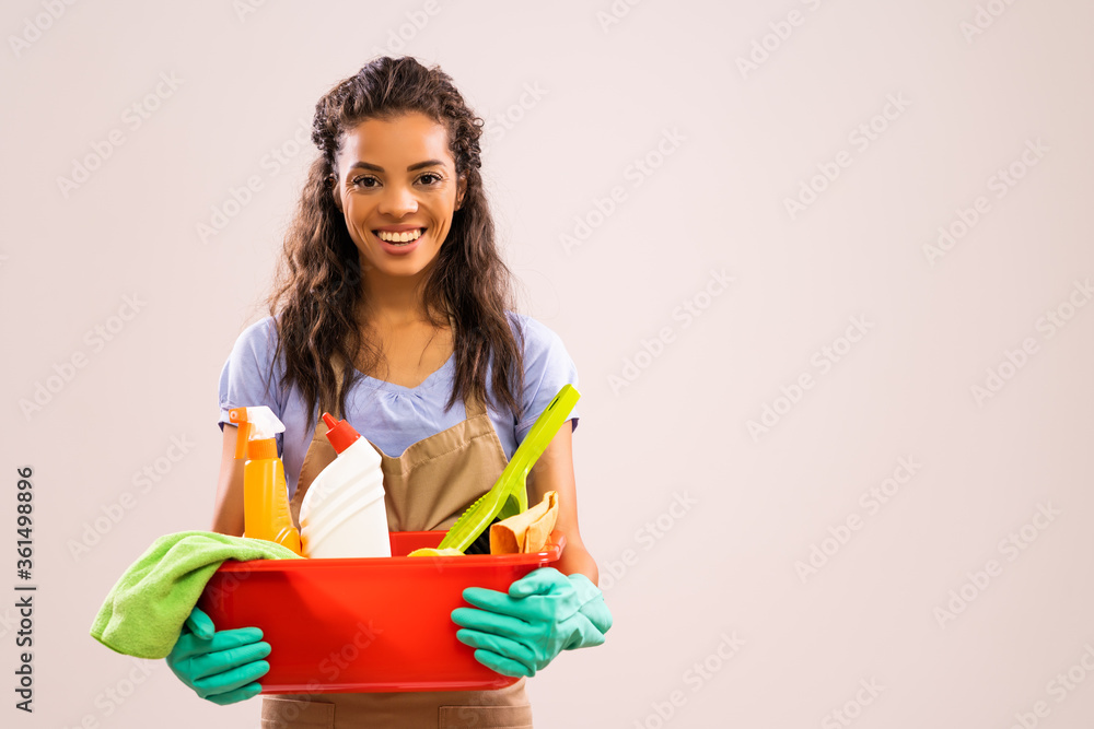 Wall mural Portrait of african-american housewife who is ready for housework.