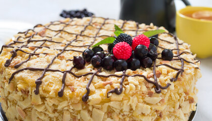 Classic Napoleon cake. Delicious festive layered dessert with puff pastry and custard decorated with fresh berries. Traditional russian treat. Close up