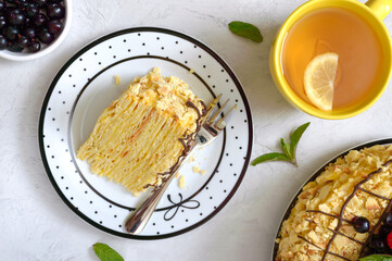 Classic Napoleon cake. A piece of delicious festive layered dessert with puff pastry and custard....