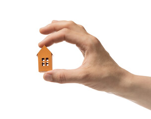 Paper house in the woman hand. On white isolated background. Concept of rent, search, purchase real estate.