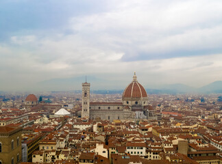Fototapeta na wymiar Firenze 2016, aerial view of the red roofs of the city and of the brunelleschi's dome of Santa Maria del Fiore church from the Arnolfo's tower