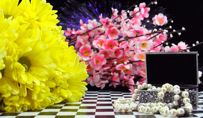Yellow Flowers With Perfume and Jewelry