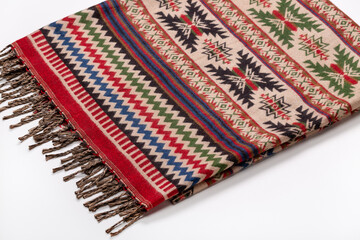 Woolen scarf with native american ornament on a white background. Studio shot.
