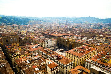 Florence, Italy. An aerial view of the city landscape seen from the bell tower of Santa Maria del Fiore church. Here you can see the Republic Square surrounded by the typical red roofs of the town