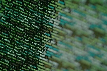 Green unique background. Programming language on laptop computer screen. Program code PHP HTML...