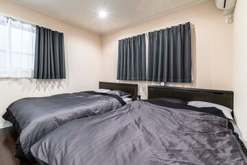 Twin beds in a modern bedroom at the condominium