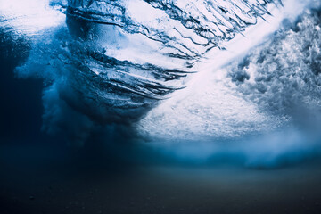 Underwater wave crashing in ocean. Transparent water underwater
