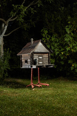 hut on chicken legs stands on the lawn