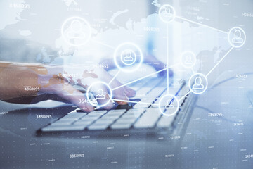 Media network theme hologram with man working on computer on background. Concept of internet...