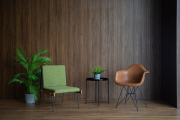 two chairs and a coffee table on a brown wall background
